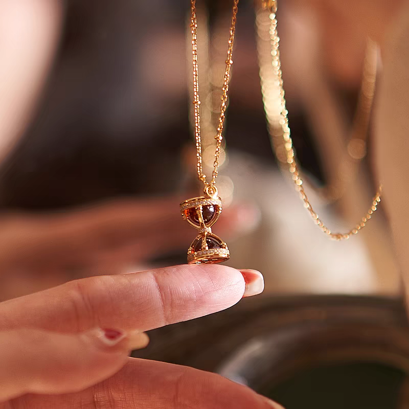 "Settled in Time" Hourglass Necklace – 925 Sterling Silver Gold-Plated Garnet Pendant